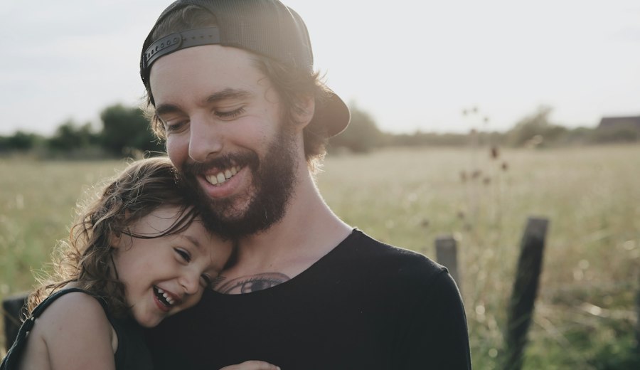 Father hugging his daughter outdoors