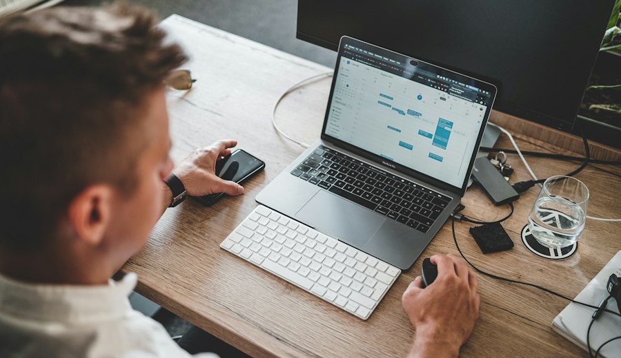Broker working at a laptop